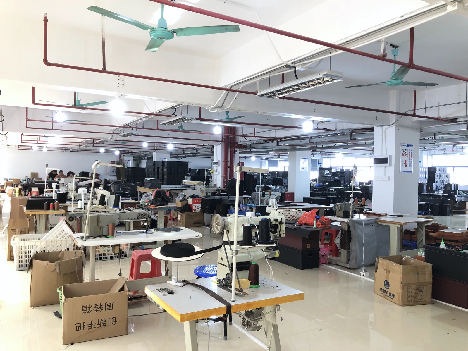Industrial sewing machines in the sewing area for bags and structured soft goods