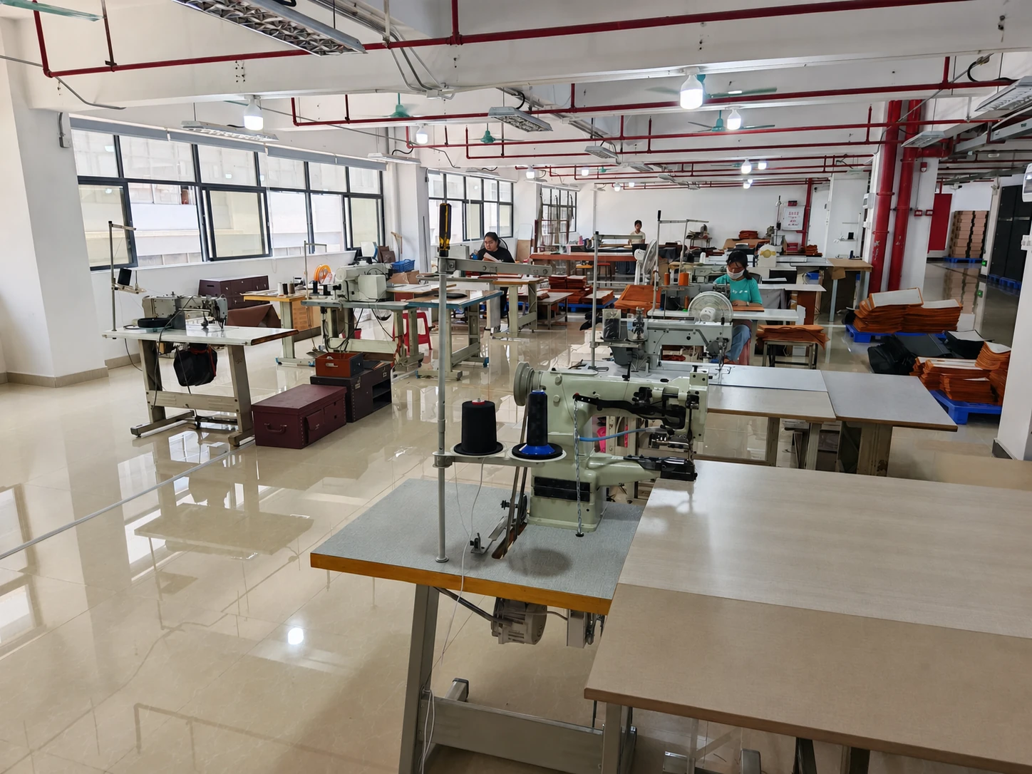 Sewing machines and workstations in a sewing workshop