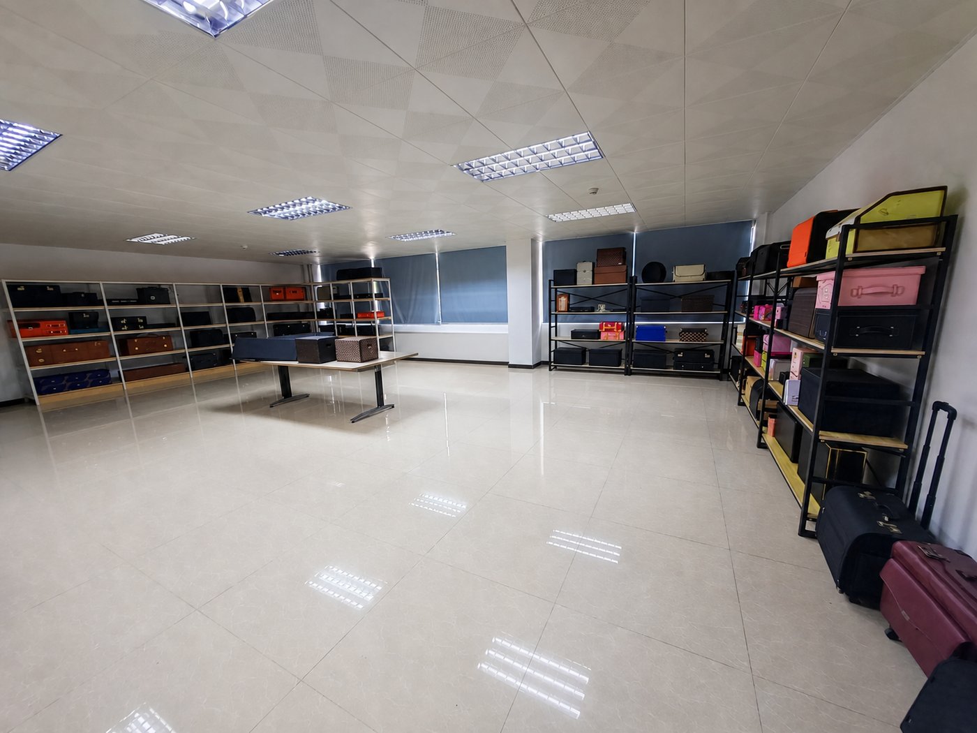 DINLEEY sample showroom with shelves of soft cases, organisers and sewn storage samples.