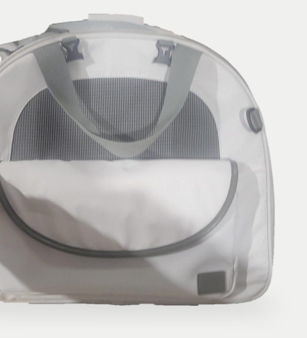 Grey pet carrier backpack sample with mesh window, front zip pocket and top handle on a plain studio background.