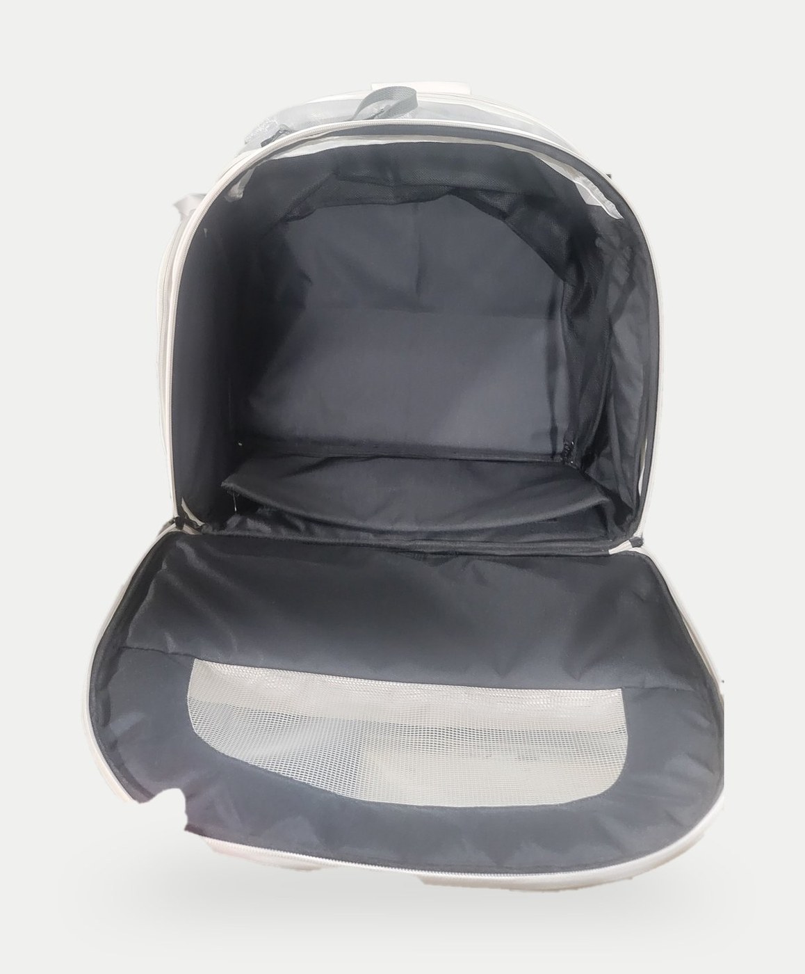 Opened pet carrier backpack sample showing dark lining, padded base and a mesh panel in the lid.